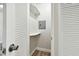 Small hall closet with built-in shelving at 5875 21St N St # 15L, St Petersburg, FL 33714
