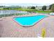 Relaxing community pool with lake view at 5875 21St N St # 15L, St Petersburg, FL 33714