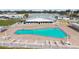 Community pool with surrounding patio and lounge chairs at 5875 21St N St # 15L, St Petersburg, FL 33714