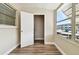 Small storage room with wood-look flooring and an open door at 5875 21St N St # 15L, St Petersburg, FL 33714