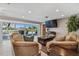 Bright living room with water views and sliding glass doors at 853 Seacrest Dr, Largo, FL 33771