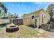 Large backyard with fire pit, shed, and wooden fence at 2905 N 13Th St, Tampa, FL 33605