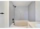 Clean bathroom with grey tile surround and bathtub at 2905 N 13Th St, Tampa, FL 33605