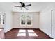 Bright bedroom with hardwood floors and ceiling fan at 2905 N 13Th St, Tampa, FL 33605