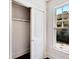 White closet with sliding doors and wooden shelving at 2905 N 13Th St, Tampa, FL 33605
