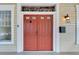 Elegant red front door with stained-glass window above at 2905 N 13Th St, Tampa, FL 33605