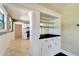 Bright kitchen with white cabinets, granite counters, and stainless steel appliances at 2905 N 13Th St, Tampa, FL 33605