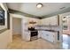 Updated kitchen featuring white cabinets, granite countertops, and stainless steel range at 2905 N 13Th St, Tampa, FL 33605