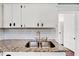 Modern double sink with granite countertop and white cabinets at 2905 N 13Th St, Tampa, FL 33605