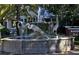 Ornate fountain with heron sculptures in a park-like setting at 1022 De Soto Dr # 1022, Dunedin, FL 34698