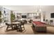 Bright game room featuring a billiard table, card table and comfortable lounge area with a large TV at 400 Central Ave # 3909, St Petersburg, FL 33701