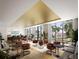 Upscale resident lounge boasts comfortable seating, a bar area and floor to ceiling windows showcasing lush greenery and tropical views at 400 Central Ave # 3909, St Petersburg, FL 33701