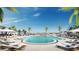 Luxurious rooftop pool with lounge chairs and palm trees overlooking the city skyline at 400 Central Ave # 3909, St Petersburg, FL 33701