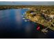 Breathtaking aerial shot showcasing waterfront property with a private dock on the water and scenic treelined views at 1100 Monterey Ne Blvd, St Petersburg, FL 33704
