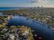Panoramic aerial shot of a waterfront community with city views, waterways, lush landscaping, and private docks at 1100 Monterey Ne Blvd, St Petersburg, FL 33704