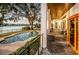 Backyard view showing the pool, outdoor patio, waterway, and beautiful landscaping at 1100 Monterey Ne Blvd, St Petersburg, FL 33704