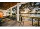 Beautiful sunset on the waterfront as seen from the backyard covered patio with modern seating at 1100 Monterey Ne Blvd, St Petersburg, FL 33704