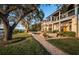 Backyard featuring manicured lawn, lounge area, pool, and beautiful landscaping at 1100 Monterey Ne Blvd, St Petersburg, FL 33704