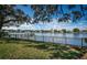 Waterfront backyard with green lawn and wrought iron fence overlooking the water at 1100 Monterey Ne Blvd, St Petersburg, FL 33704