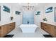 Elegant bathroom featuring a freestanding tub, dual vanities, and stylish tile accents at 1100 Monterey Ne Blvd, St Petersburg, FL 33704