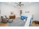 bedroom with white walls, wood floors, blue area rug and a playhouse bunk bed with slide at 1100 Monterey Ne Blvd, St Petersburg, FL 33704