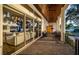 Covered patio features brick flooring, ceiling fan, and sliding glass doors that lead to a living room at 1100 Monterey Ne Blvd, St Petersburg, FL 33704