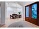 Bright dining room featuring hardwood floors, arched doorways, high ceilings, a modern chandelier, and stylish furnishings at 1100 Monterey Ne Blvd, St Petersburg, FL 33704