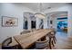 Dining room features an oversized table for gatherings, statement lighting, and access to multiple living spaces at 1100 Monterey Ne Blvd, St Petersburg, FL 33704