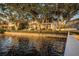 Waterfront property featuring luxury home, boat dock and serene water views at 1100 Monterey Ne Blvd, St Petersburg, FL 33704