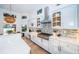 Bright open kitchen with a center island, stainless steel appliances, and custom cabinetry at 1100 Monterey Ne Blvd, St Petersburg, FL 33704