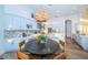 Bright kitchen featuring an eat-in kitchen, modern appliances, and white cabinetry at 1100 Monterey Ne Blvd, St Petersburg, FL 33704