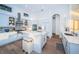 Bright kitchen featuring modern appliances, a center island, and white cabinetry at 1100 Monterey Ne Blvd, St Petersburg, FL 33704