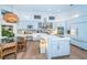 Bright open kitchen with a center island, stainless steel appliances, and custom cabinetry at 1100 Monterey Ne Blvd, St Petersburg, FL 33704