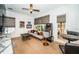 Open living room featuring a games table, vintage arcade game and comfortable seating at 1100 Monterey Ne Blvd, St Petersburg, FL 33704