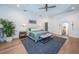 Airy main bedroom featuring natural light, tray ceilings, hardwood floors, and modern decor at 1100 Monterey Ne Blvd, St Petersburg, FL 33704