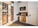 A covered outdoor kitchen features a grill, sink, counter space, and stainless steel appliances at 1100 Monterey Ne Blvd, St Petersburg, FL 33704
