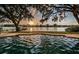 Backyard pool at sunset with stunning waterfront views at 1100 Monterey Ne Blvd, St Petersburg, FL 33704
