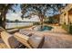 Backyard oasis featuring a pool with water views and lounge chairs at 1100 Monterey Ne Blvd, St Petersburg, FL 33704