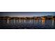 Scenic night view of waterfront homes reflecting lights on calm waters at 1100 Monterey Ne Blvd, St Petersburg, FL 33704
