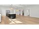 Spacious open-concept layout with a kitchen island, stainless appliances, and an open dining area at 1001 E New Orleans Ave, Tampa, FL 33603