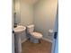 Clean bathroom with pedestal sink and updated fixtures at 10235 Villa Palazzo Ct, Tampa, FL 33615