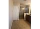 Bathroom with shower, double vanity, and tile flooring at 10235 Villa Palazzo Ct, Tampa, FL 33615
