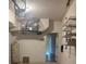 Garage interior with water heater and shelving at 10235 Villa Palazzo Ct, Tampa, FL 33615