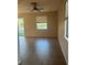 Spacious living room with tile flooring and large windows at 10235 Villa Palazzo Ct, Tampa, FL 33615