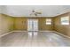 Spacious living area with tiled floors and French doors at 7620 Dennison Dr, Tampa, FL 33619