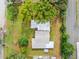 Aerial view of a house and yard with mature trees at 4014 Brower Dr, Seffner, FL 33584