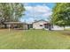 Large backyard with covered carport and spacious lawn at 4014 Brower Dr, Seffner, FL 33584