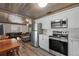 Updated kitchen featuring stainless steel appliances and wood accent ceiling at 4014 Brower Dr, Seffner, FL 33584