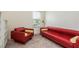 Bright office with red leather couch and built-in shelving at 8011 Marbella Creek Ave, Tampa, FL 33625