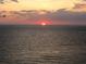 Stunning ocean view featuring a colorful sunset over the horizon at 2109 Gulf Blvd # 1B, Indian Rocks Beach, FL 33785